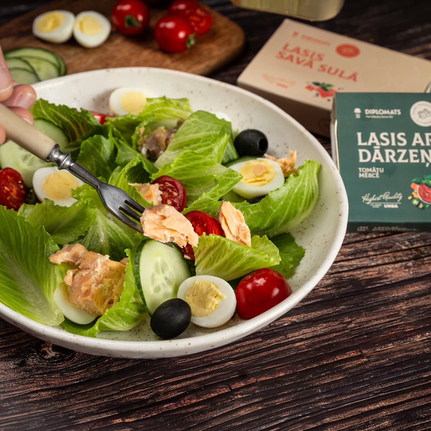 Salmon served with fresh salad, egg, cucumber and tomatoes