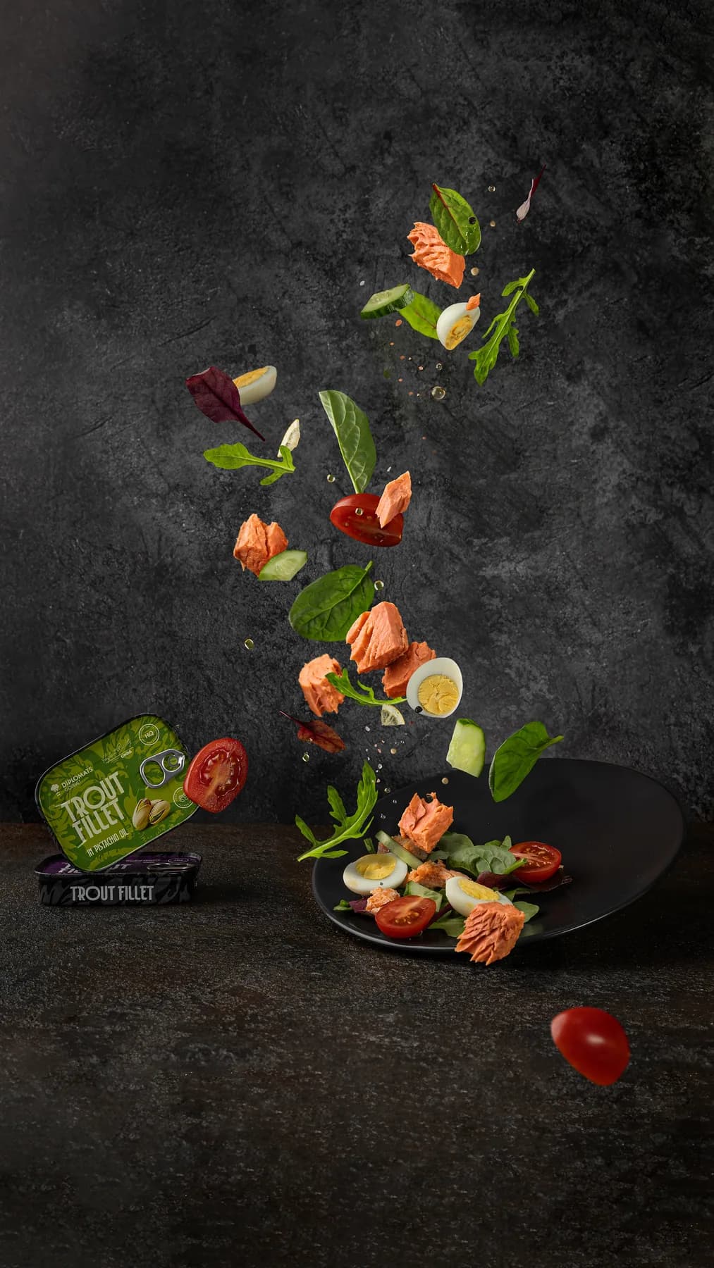 Diplomats trout served with vegetables beside its tin