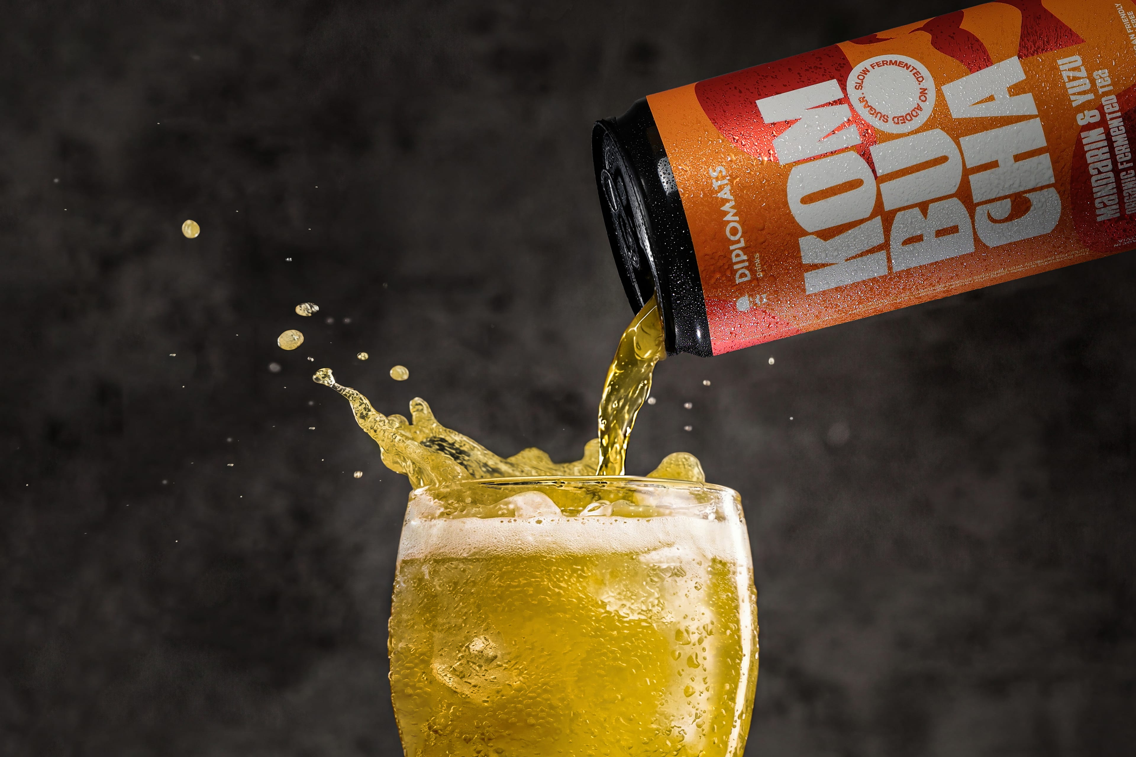Diplomats kombucha being poured into a glass